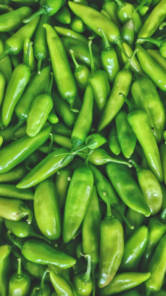 Fresh green chile peppers in close-up